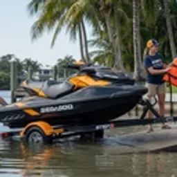 Sea-Doo jet ski being launched from a dock ramp